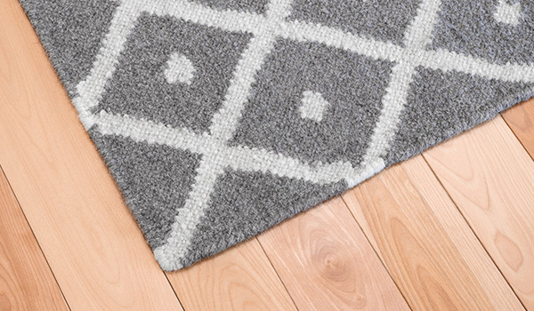 Gray-rug-on-wood-floor